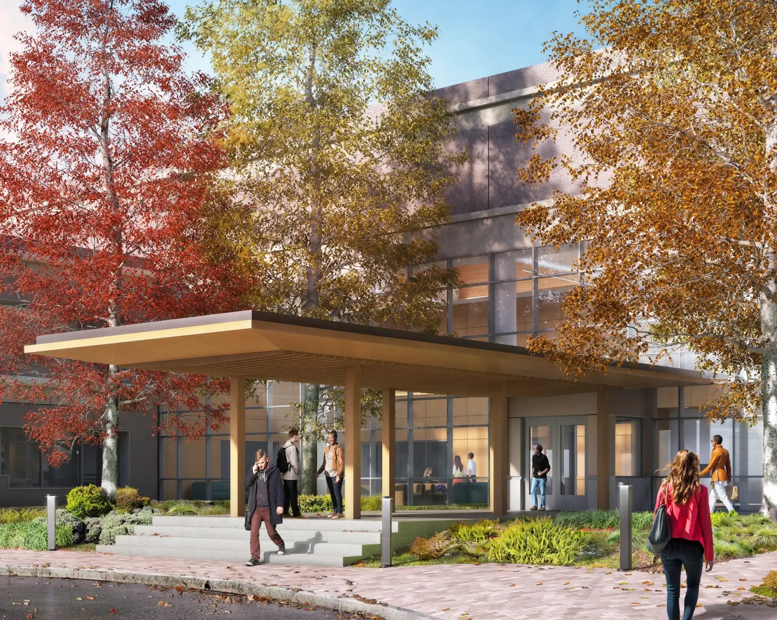 Contemporary workplace exterior with seasonal trees and outdoor path leading to main entrance